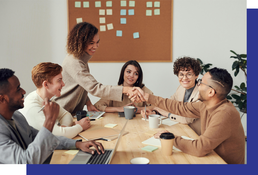 A group of professionals gathered around a table having a discussion.