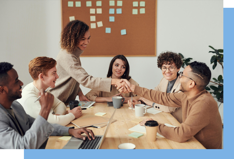 A group of professionals gathered around a table.